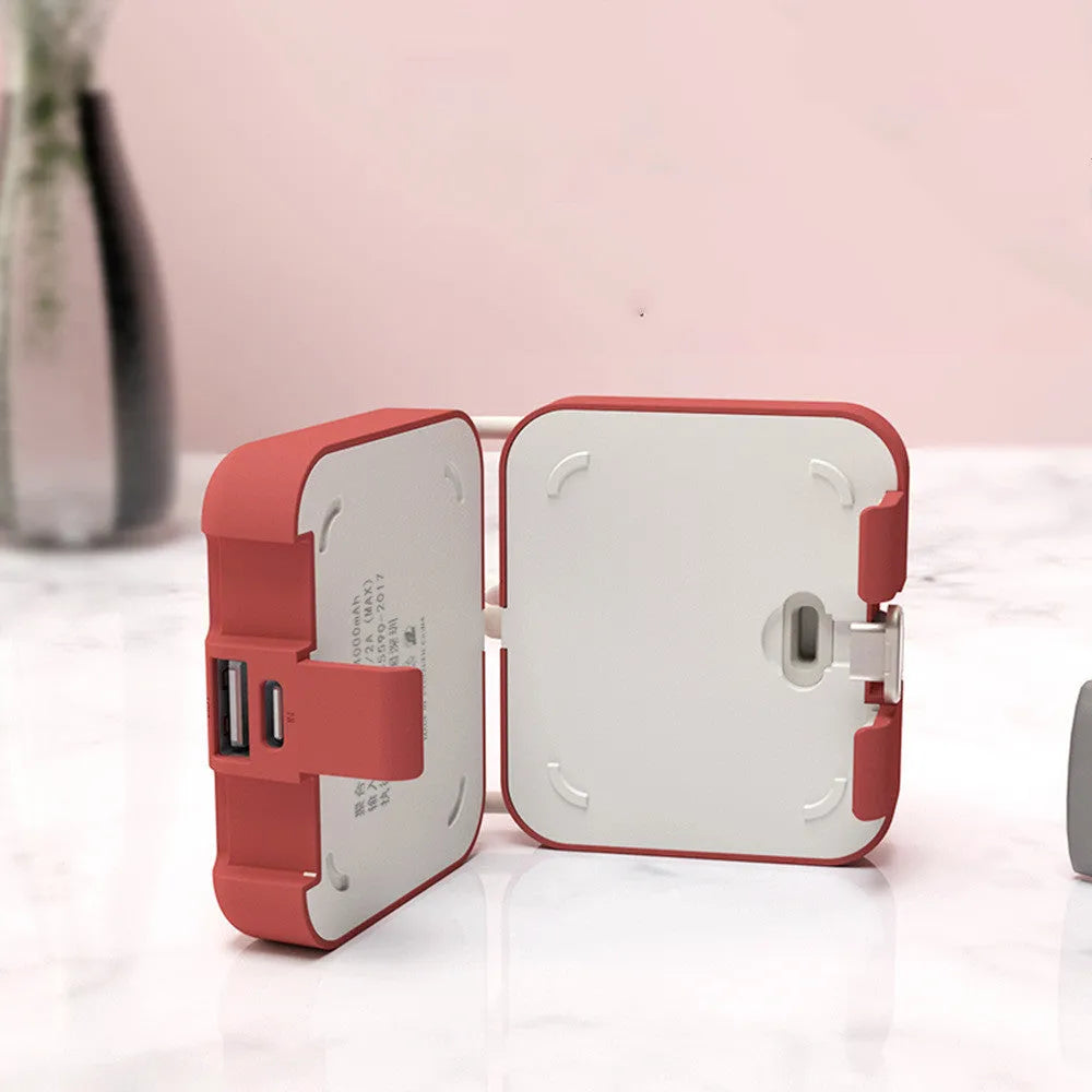 Handbag back clip power bank in four colours showing clip mechanism and dual charging ports