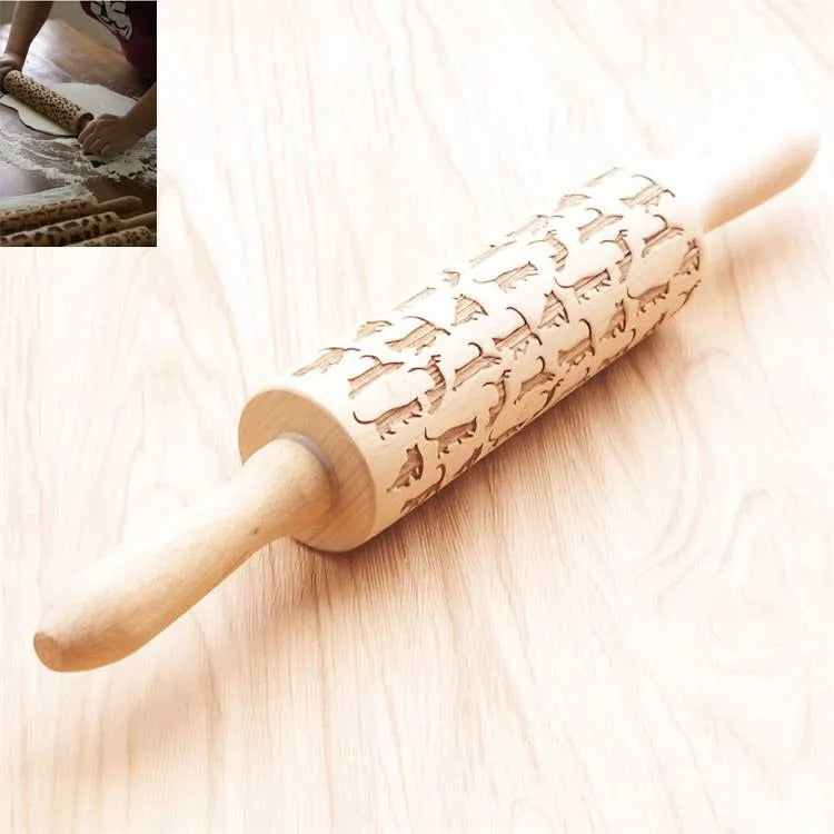 Solid wood rolling pin with embossed Christmas reindeer pattern on a 45cm long shaft.