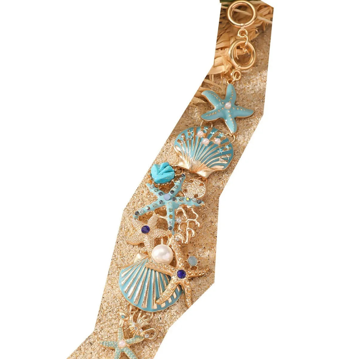 Women's alloy bracelet with starfish design in turquoise, coral red, or coral blue with marine shell and boat anchor elements