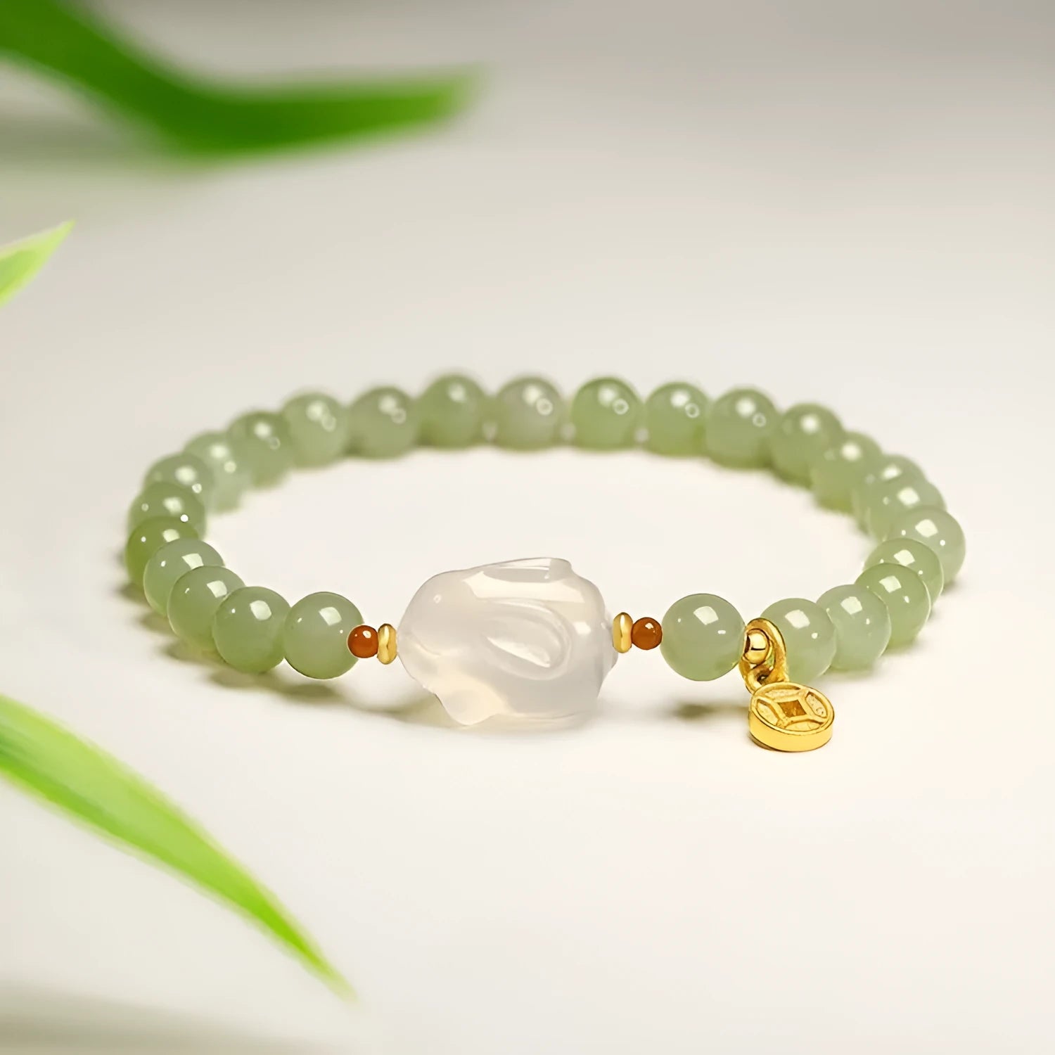 Handmade Hetian jade rabbit bracelet for women in glass, showing rabbit charm designs.