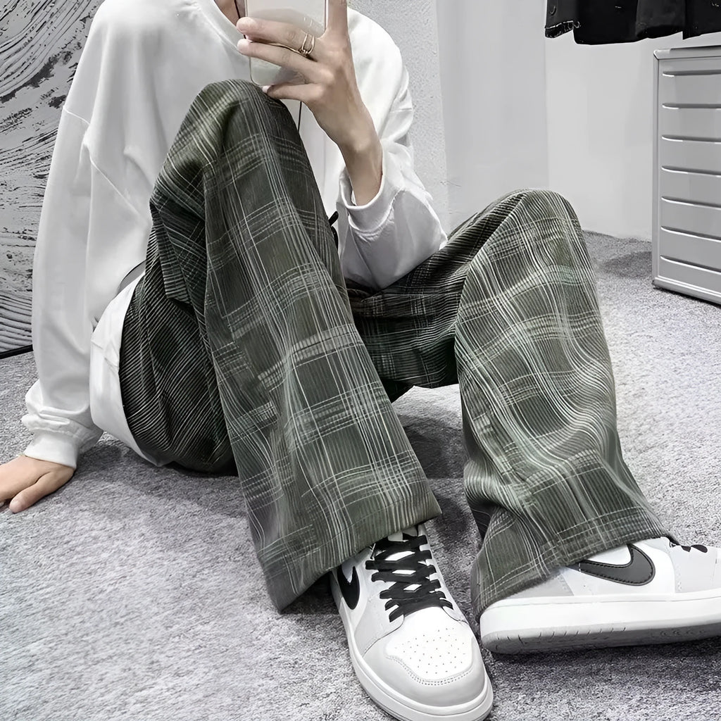 Men's black and green plaid trousers with straight leg design and mid-rise waistband
