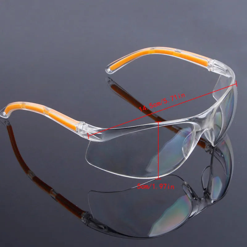 Transparent yellow safety goggles made of polycarbonate for eye protection.