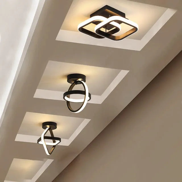 Modern round black ceiling light with white acrylic shade and adjustable tri-colour LED.