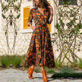 Printed chiffon dress with V-neck collar and A-line skirt in midi length