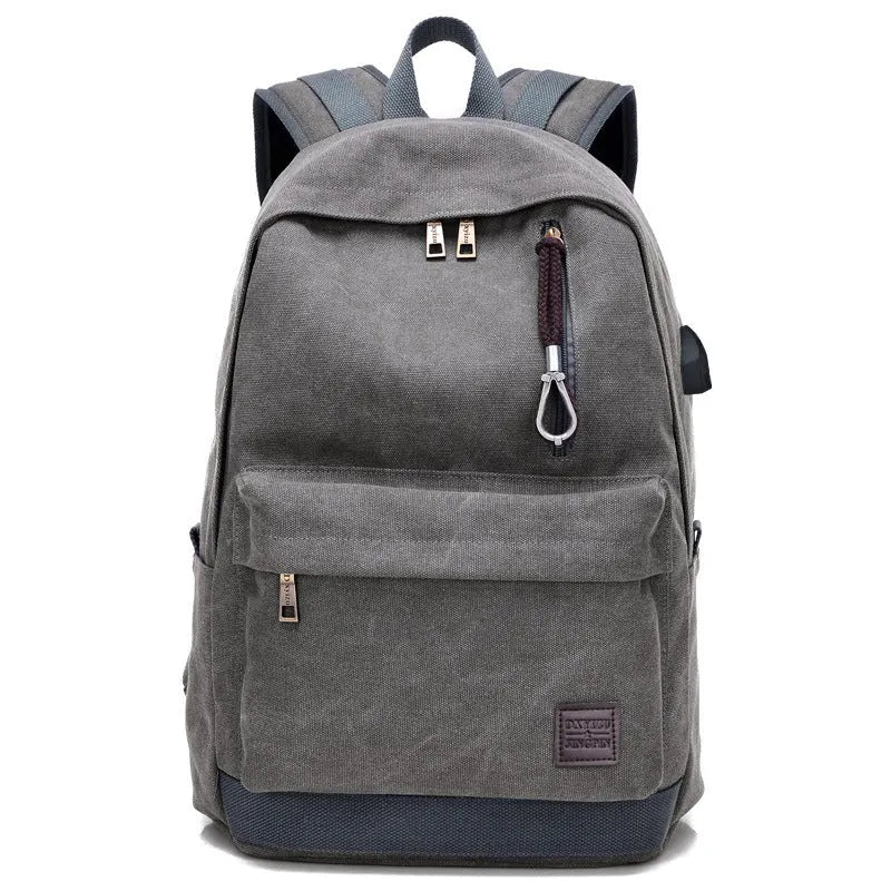 Canvas backpack with USB charging port showing front organisational pockets and adjustable shoulder straps