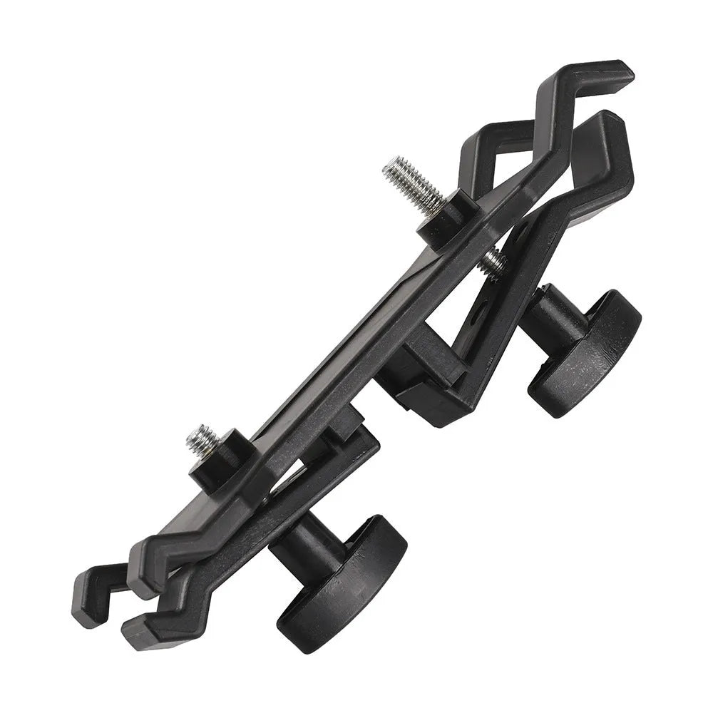 Black camera umbrella clip attached to tripod with umbrella for filming protection