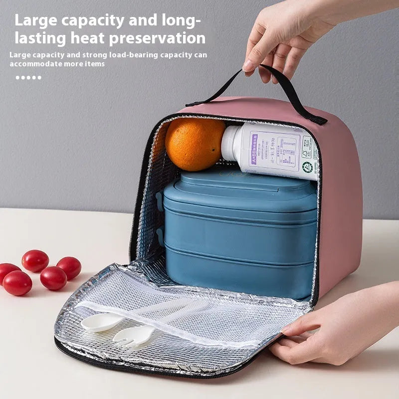 Insulated lunch box bag in sapphire blue with textured cloth exterior and secure closure