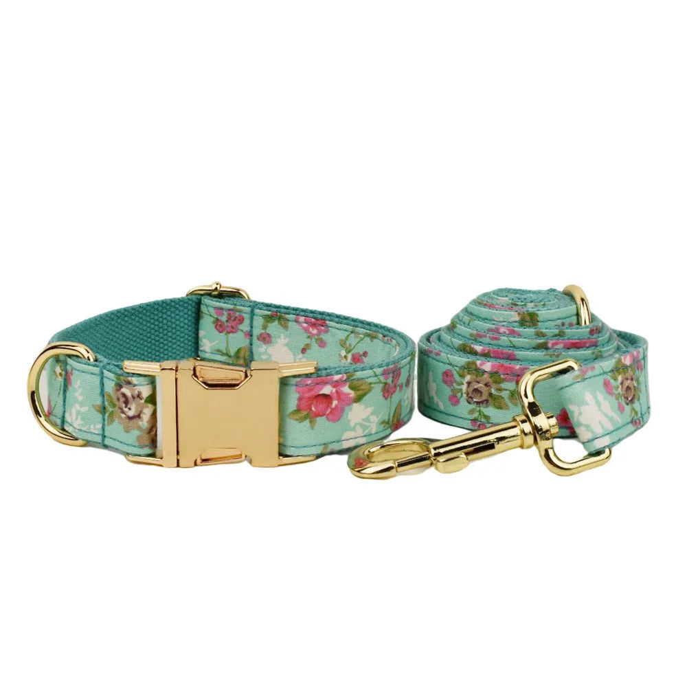 Rose pattern with green background fabric dog collar, leash, detachable bow, and vest set for pets.