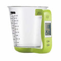 Green electronic scale measuring cup with integrated LCD display showing weight and temperature readings