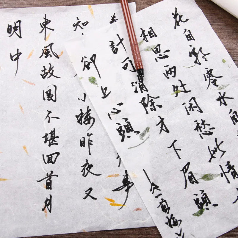 Ten sheets of Chinese ancient-style painting paper in green, red, and yellow designs, measuring 27.5 by 16.7 cm