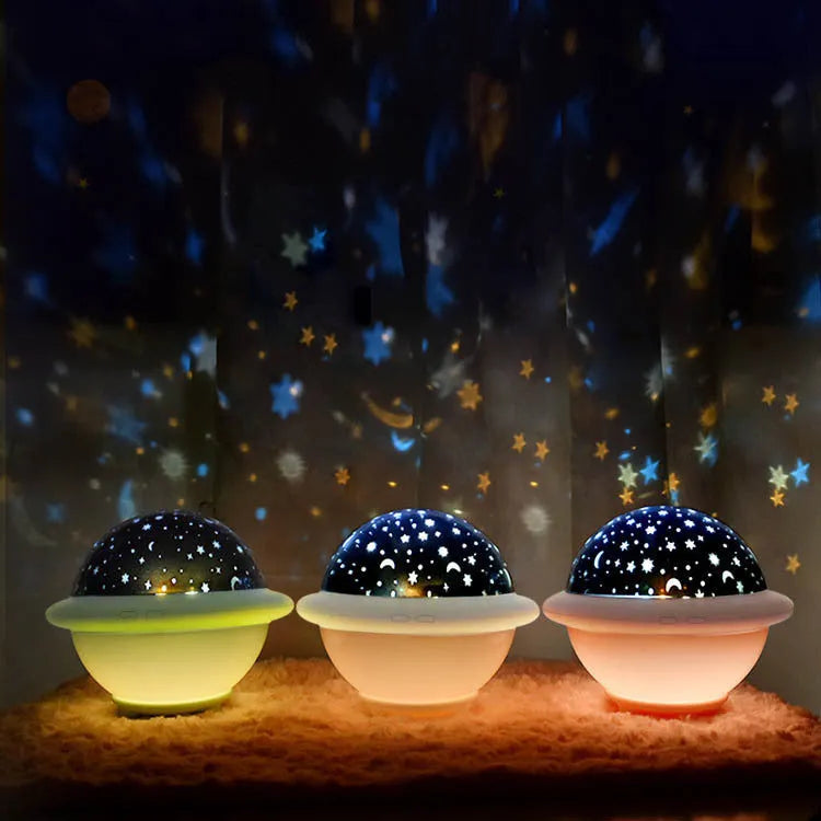 UFO-shaped starry sky projection light with LED technology in pink, white, or green colours, measuring 15.1 cm wide