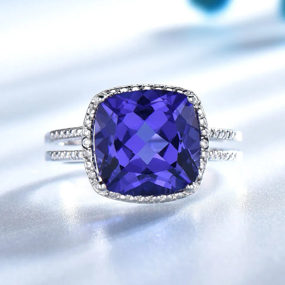 Women's 925 sterling silver ring with blue tanzanite gemstone, shown in UK sizes 6-10 for precise fit