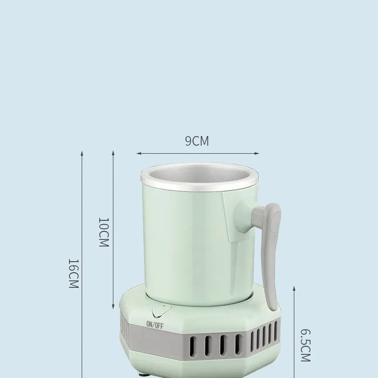 White portable aluminium quick-cooling cup and base on a desk next to a coffee mug.