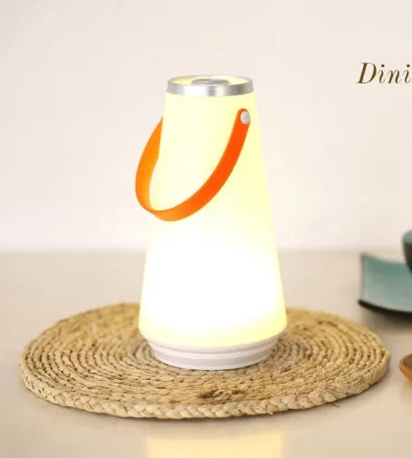 White rechargeable LED bedside table lamp with a compact ABS plastic body and soft warm white glow.