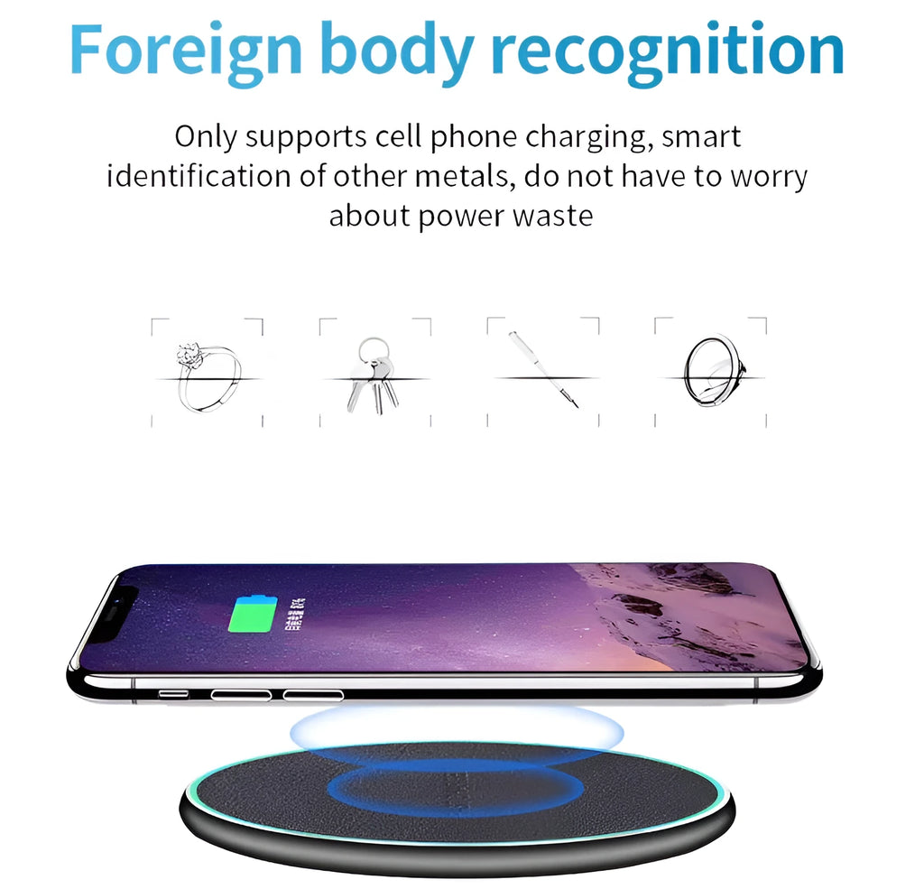 Black Quick Qi wireless charging pad for iPhone 11 on a wooden desk.