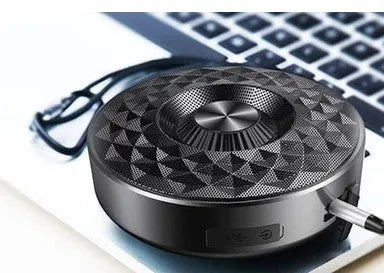 Black Bluetooth mini speaker with control buttons on top, measuring 10cm by 5cm