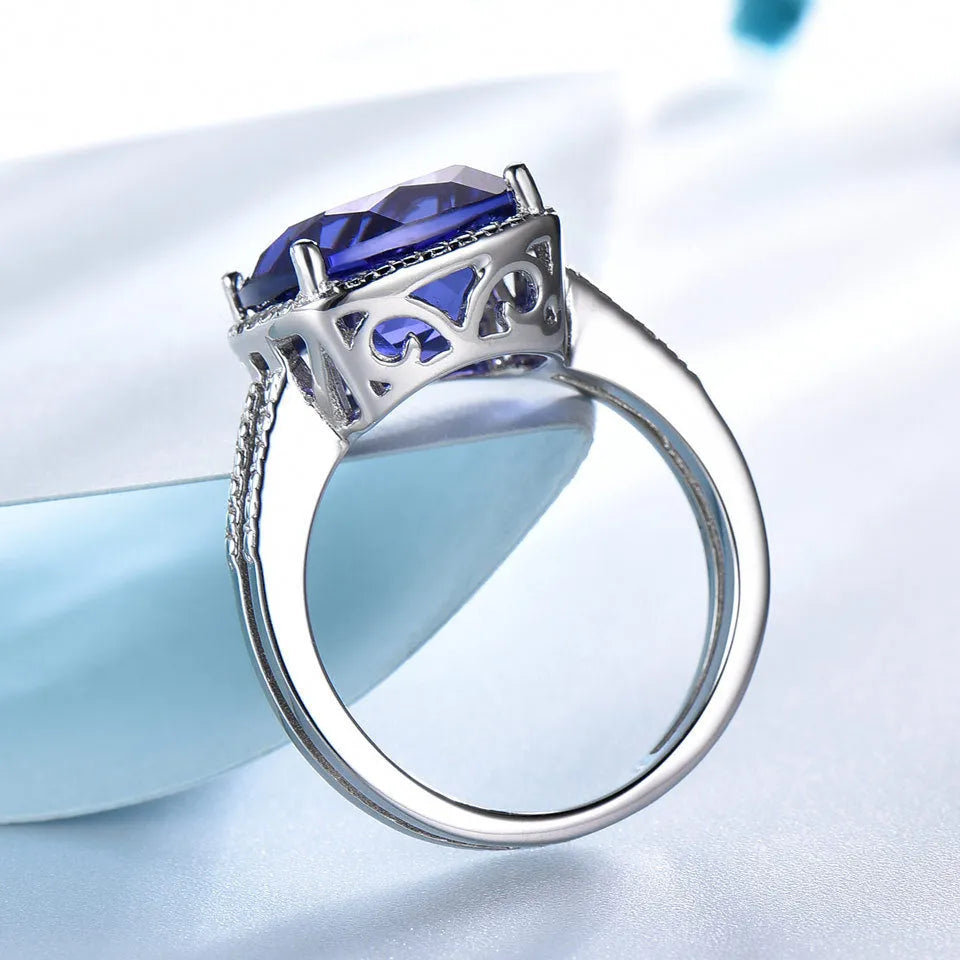 Women's 925 sterling silver ring with blue tanzanite gemstone, shown in UK sizes 6-10 for precise fit