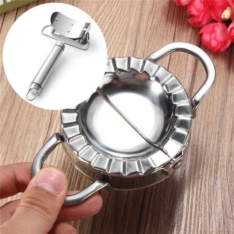 Stainless steel dumpling mould and rectangular dough cutter on a kitchen surface.