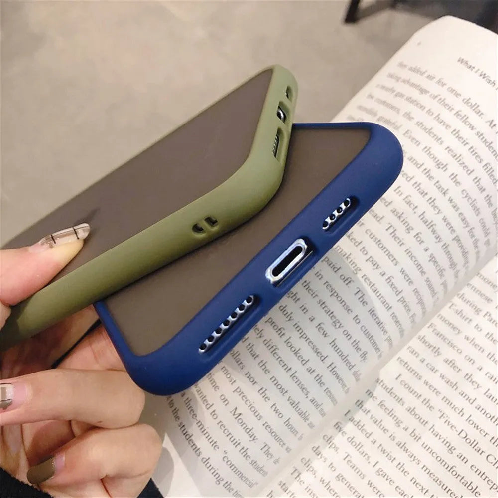 Solid colour silicone shockproof protective case for iPhone on a table.