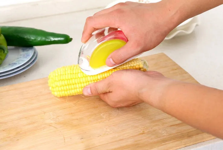 Kitchen corn separator with stainless steel blade and plastic shell for removing kernels from cobs