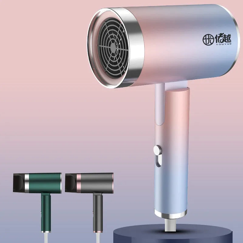 Foldable negative ion hair dryer in emerald green with folded handle and single nozzle