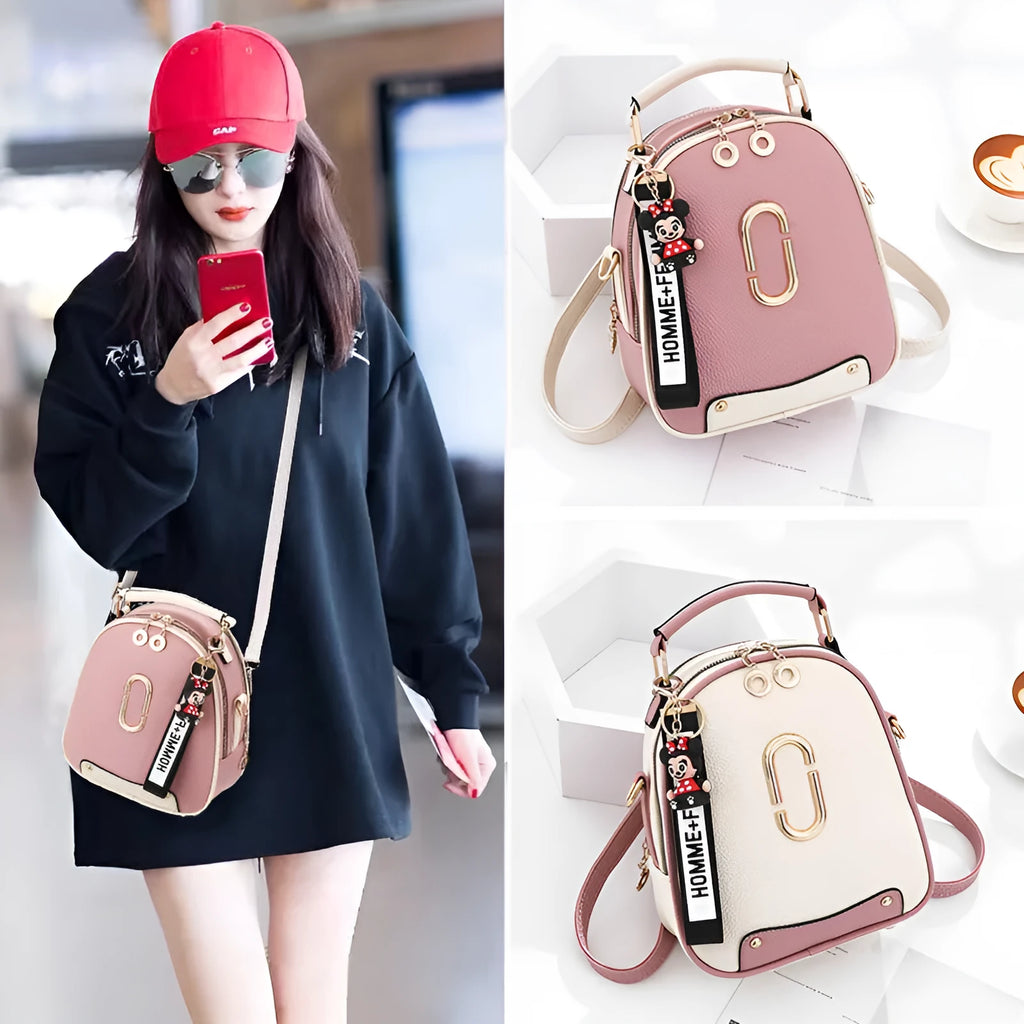 Women's PU leather oval fashion backpack with zip closure, multiple internal pockets and soft handle in white, red, black or pink