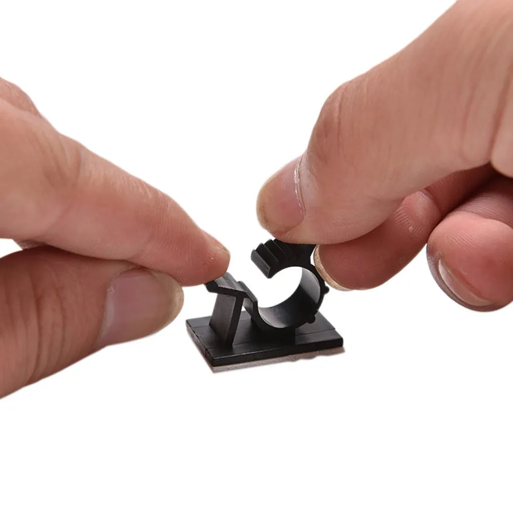 Ten black nylon adhesive cable clamps with two-stage lock for 13mm wires.