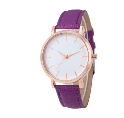 Square-faced quartz watch with an alloy case and a PU leather strap on a wrist.