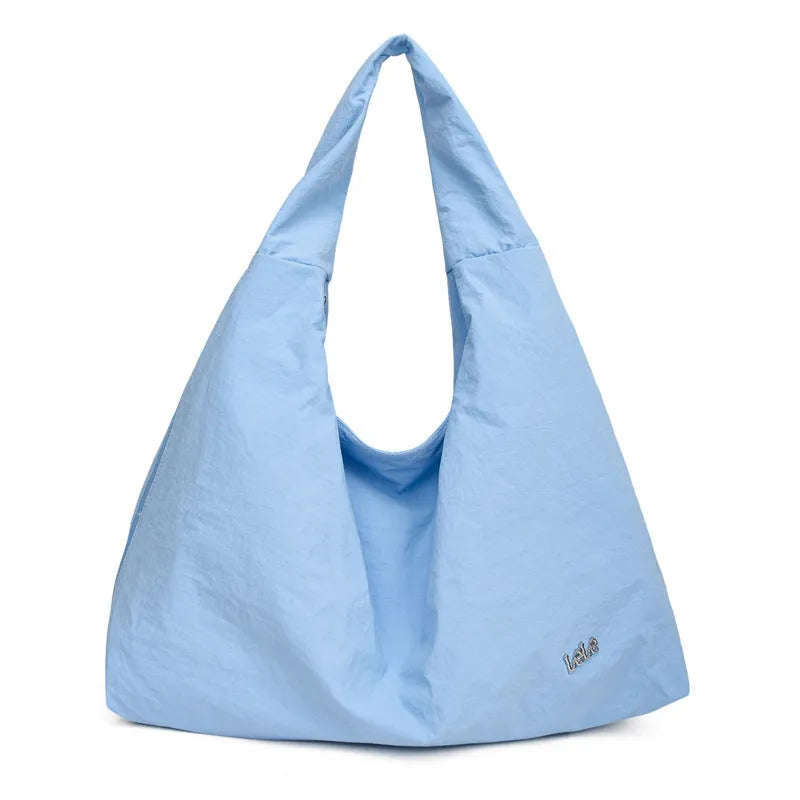 Heart-shaped nylon underarm bag for women in black, blue, khaki, or yellow, showing large capacity and soft design