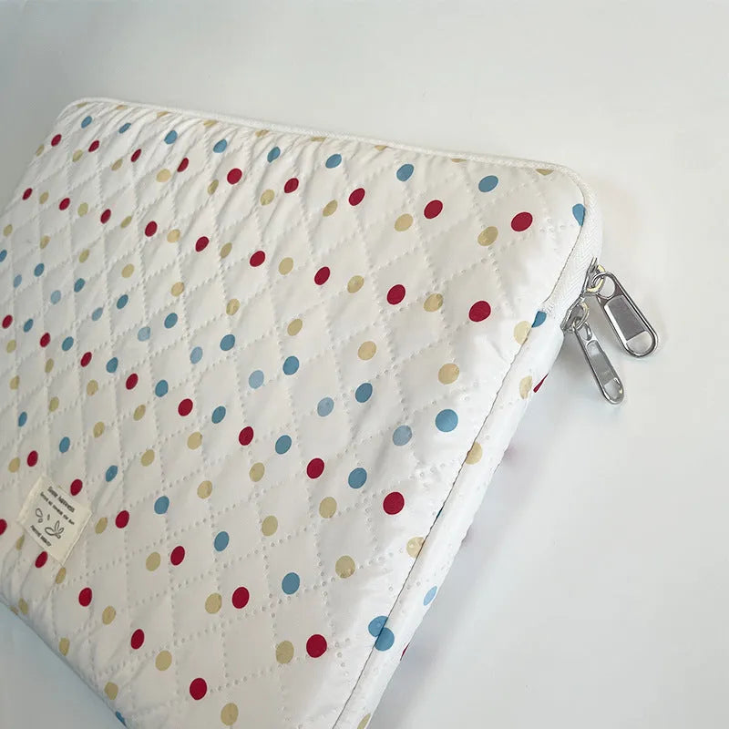 Women's polka dot polyester laptop bag shown in three sizes for 11-inch, 13-inch, and 15-inch laptops.
