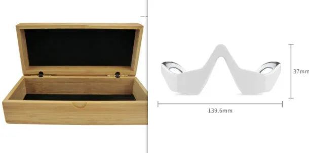 Pink and white USB rechargeable micro-current eye massager with glasses-style frame on a grey background.