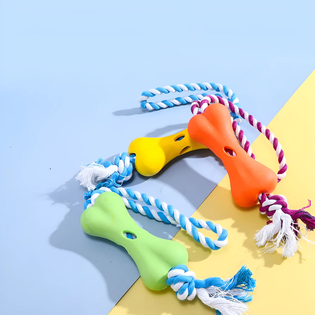 Green porous bone-shaped dog toy with rope knot texture for treat stuffing and teeth cleaning