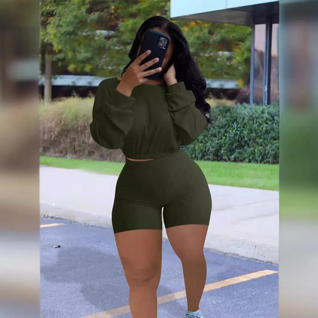 Women's solid colour off-the-shoulder long sleeve top and shorts two-piece set.