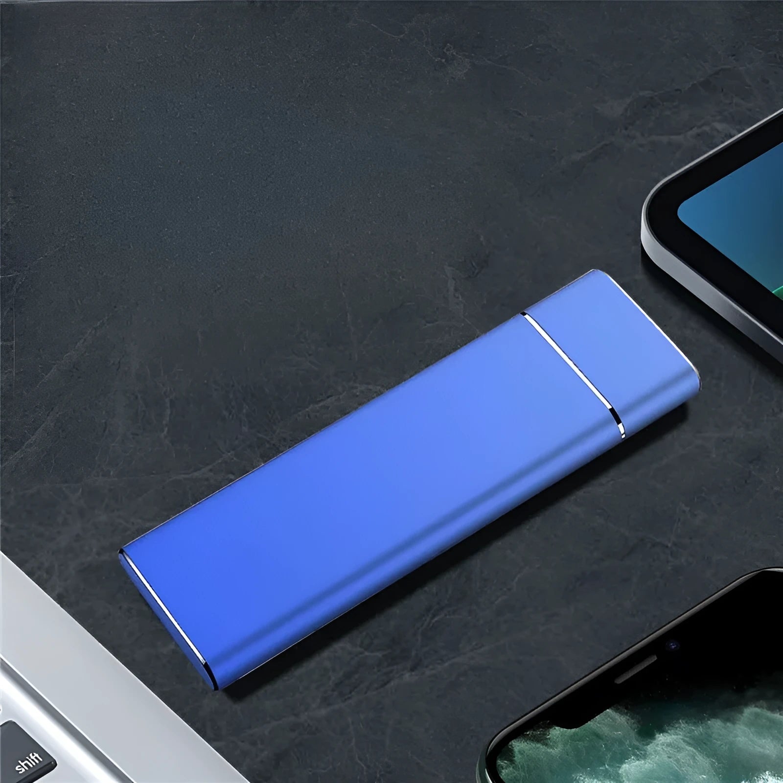 Sapphire blue portable external solid state hard disk drive with metal shell next to a USB cable.