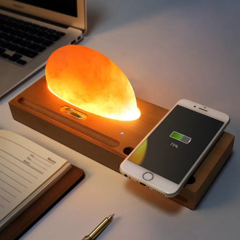 Wireless charging salt lamp with natural crystal salt shade on a solid beech wood base.