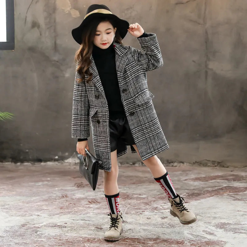 Girls grey and white houndstooth check coat with a suit collar and long sleeves.