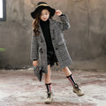 Girls grey and white houndstooth check coat with a suit collar and long sleeves.