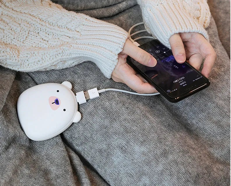 Cartoon penguin polar bear design USB hand warmer showing double-side heating and compact 83x78x35mm dimensions