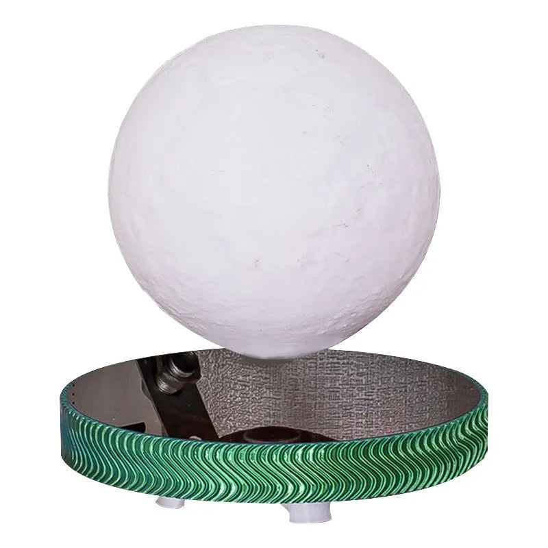 Magnetic suspension night lamp with floating 3D-printed moon ornament above base, UK plug visible