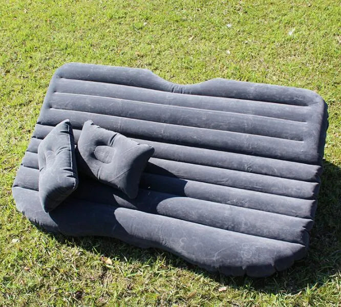 Black wave colour inflatable car bed with two pillows on a car seat