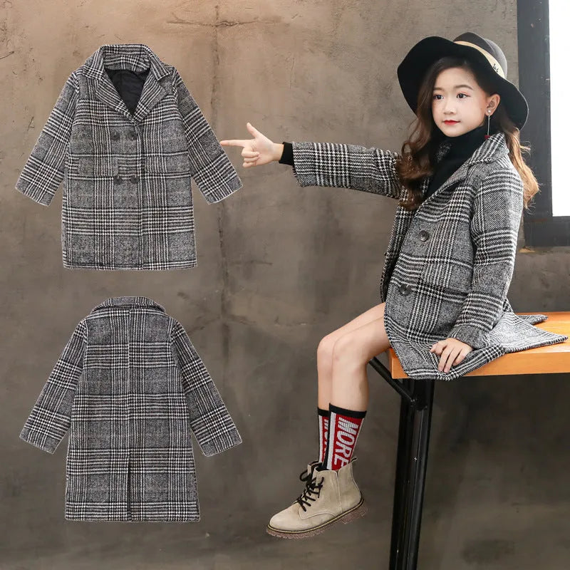 Girls grey and white houndstooth check coat with a suit collar and long sleeves.