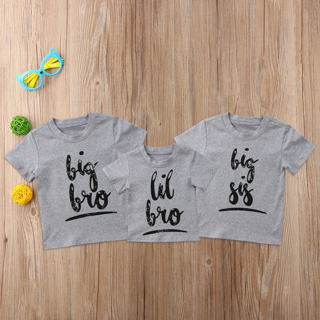 A grey printed cotton t-shirt for children showing a screen-printed graphic design on the front.