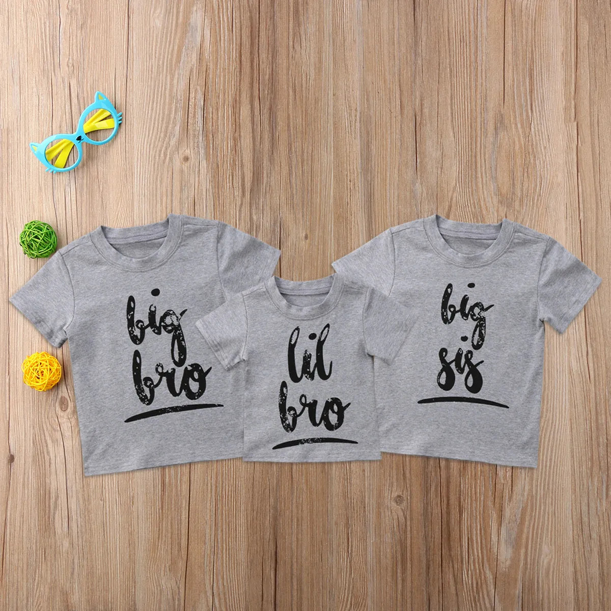 A grey printed cotton t-shirt for children showing a screen-printed graphic design on the front.