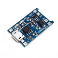 Blue lithium battery charging and protection integrated circuit board measuring 2.6cm by 1.7cm