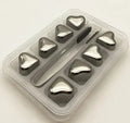 Stainless steel whiskey chilling stones in cube, ball, diamond, and heart shapes with clip
