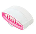 Coloured kitchen brush with knife and fork design and a white suction cup on its handle.