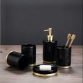 Ceramic bathroom set showing bright glaze emulsion bottle, cup, toothbrush holder, and soap dish with applique detailing.