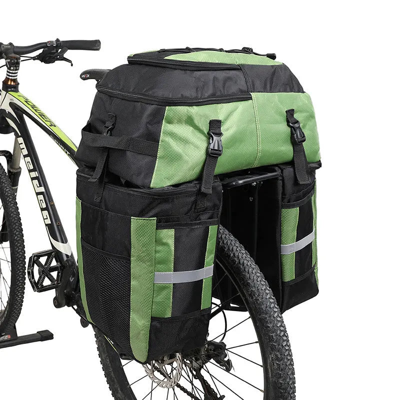 Rhinoceros brand 70-litre capacity bicycle rear frame storage bag in blue, mounted on a bike for touring.
