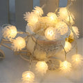 Warm white LED pine cone light string with battery operation for decorative lighting