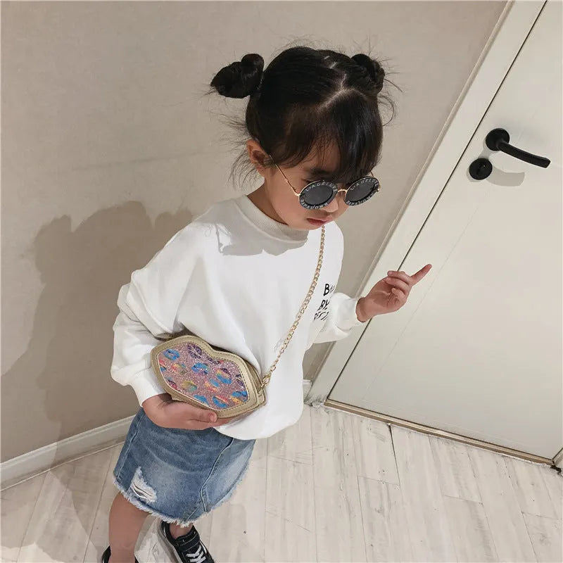Girl's PU coin purse with zip opening, 125cm shoulder strap, and compact 17cm upper width